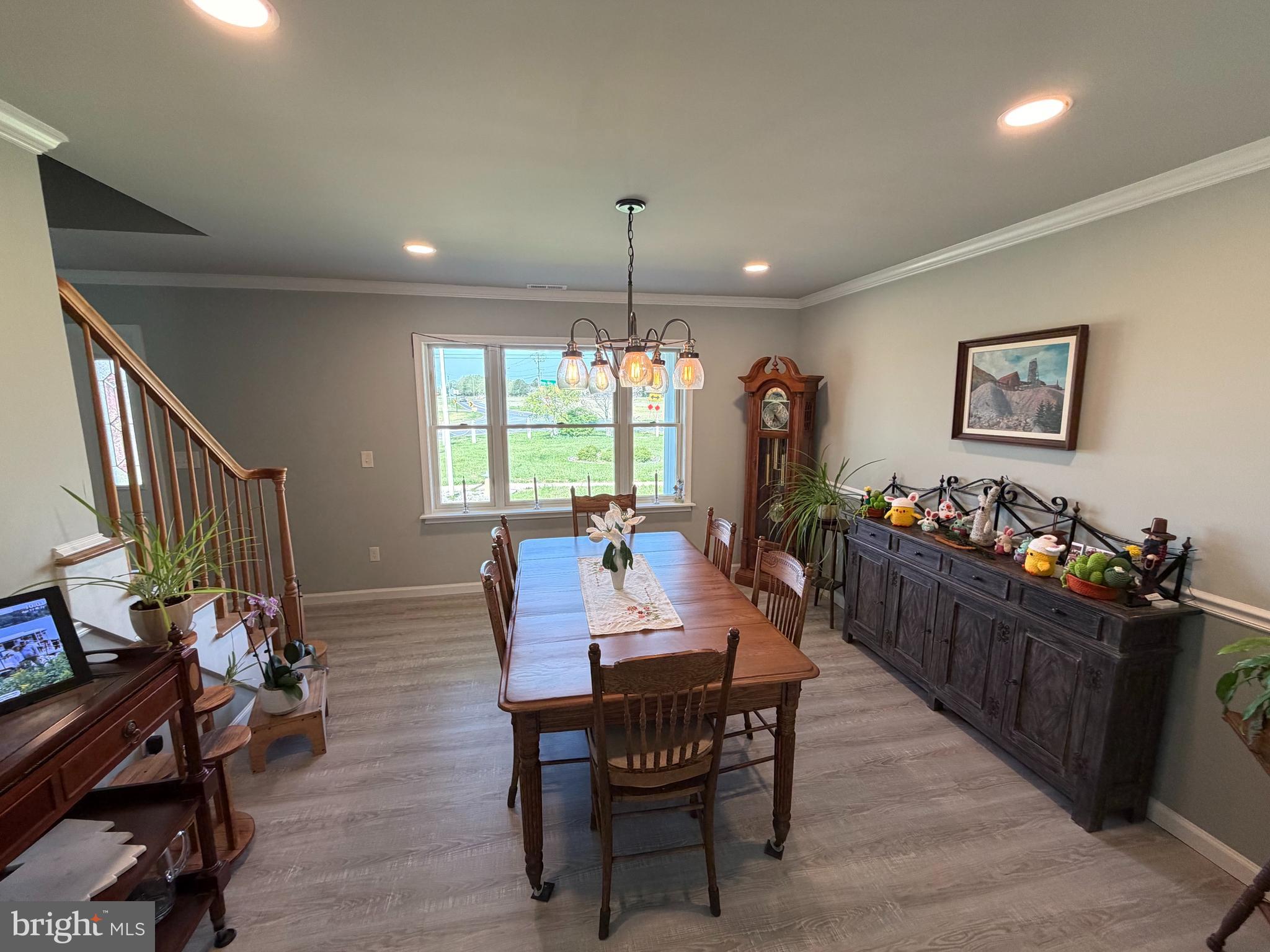36032 Double Bridges Road Frankford, DE 19945 - Photo 20 of 51 a view of a dining room with furniture window and wooden floor