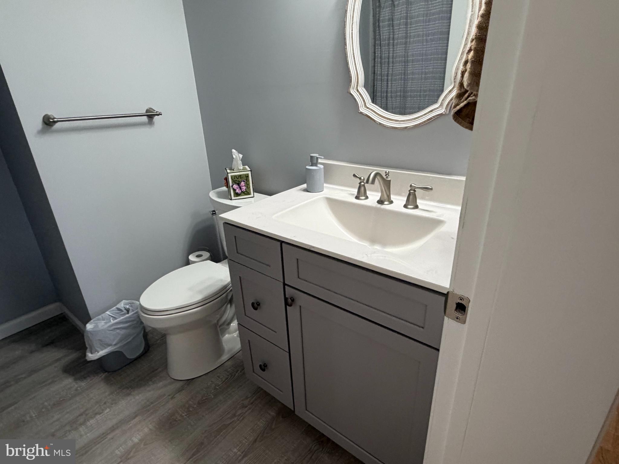36032 Double Bridges Road Frankford, DE 19945 - Photo 31 of 51 a bathroom with a toilet sink and mirror