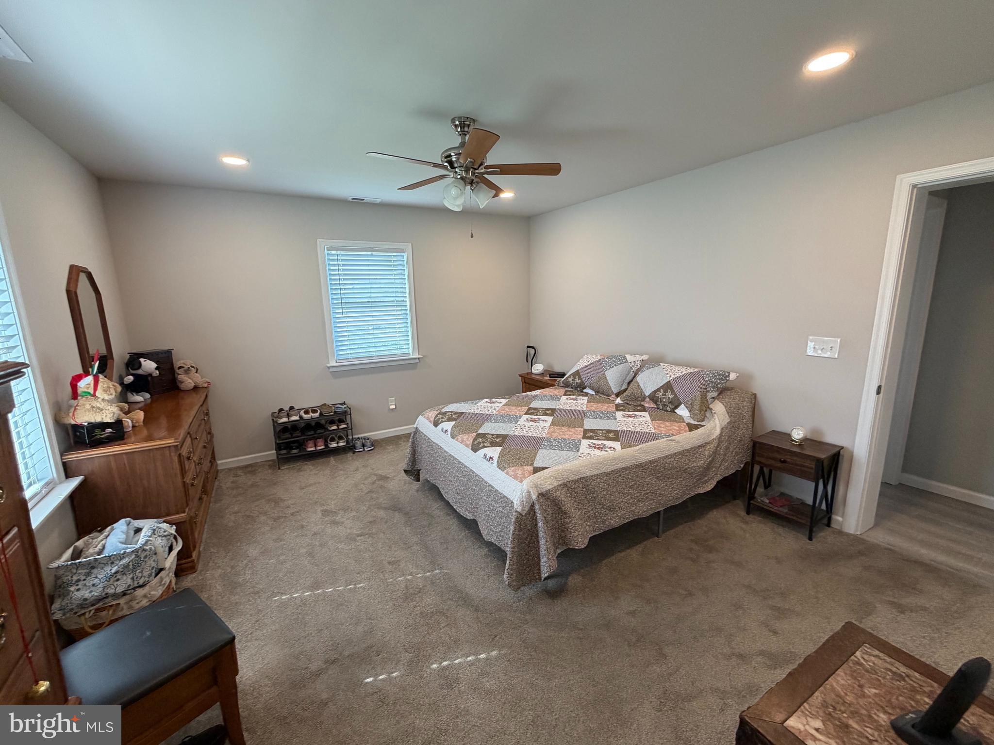 36032 Double Bridges Road Frankford, DE 19945 - Photo 35 of 51 a bedroom with bed and a chandelier