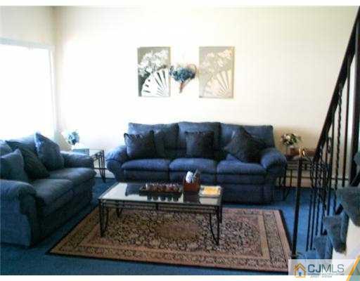 47 Inverness Terrace Fords, NJ 08863 - Photo 2 of 10 a living room with furniture and a rug