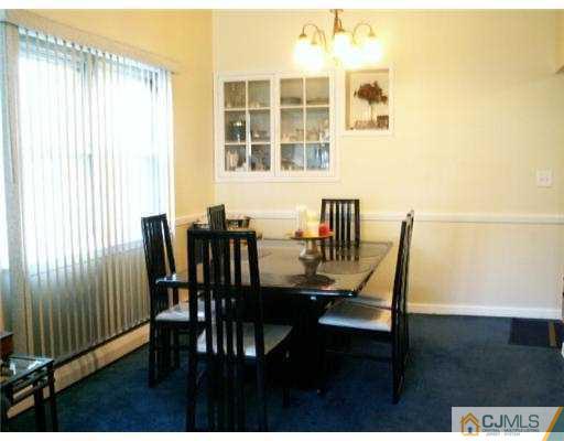 47 Inverness Terrace Fords, NJ 08863 - Photo 5 of 10 a view of a dining room with furniture and wooden floor