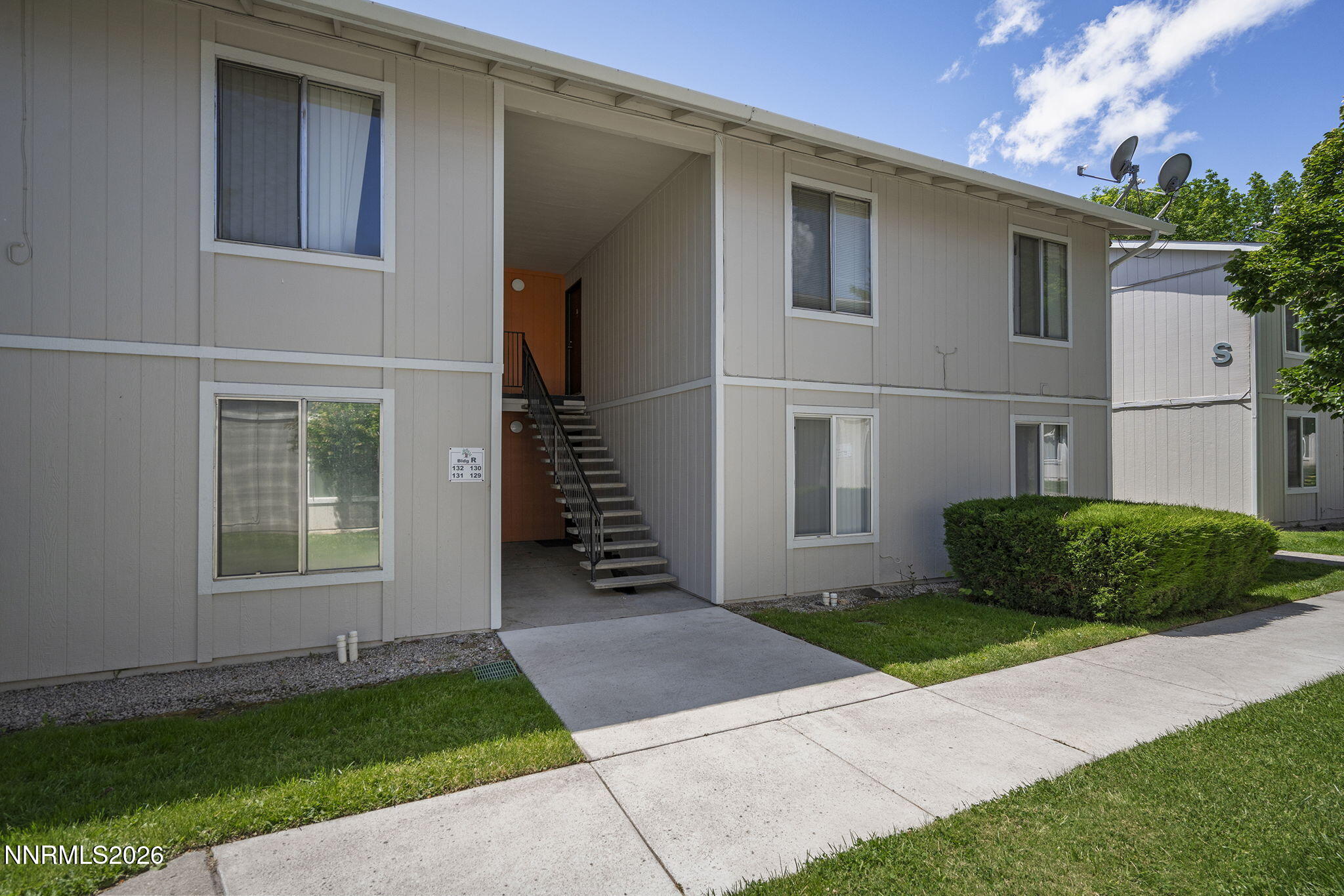 400 South Saliman Road, Unit 129 Carson City, NV 89701 - Photo 1 of 15 a front view of a house with a yard