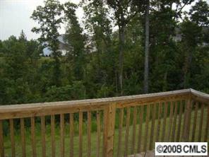 16836 Timber Crossing Road Charlotte, NC 28213 - Photo 3 of 6 a view of a roof with wooden fence