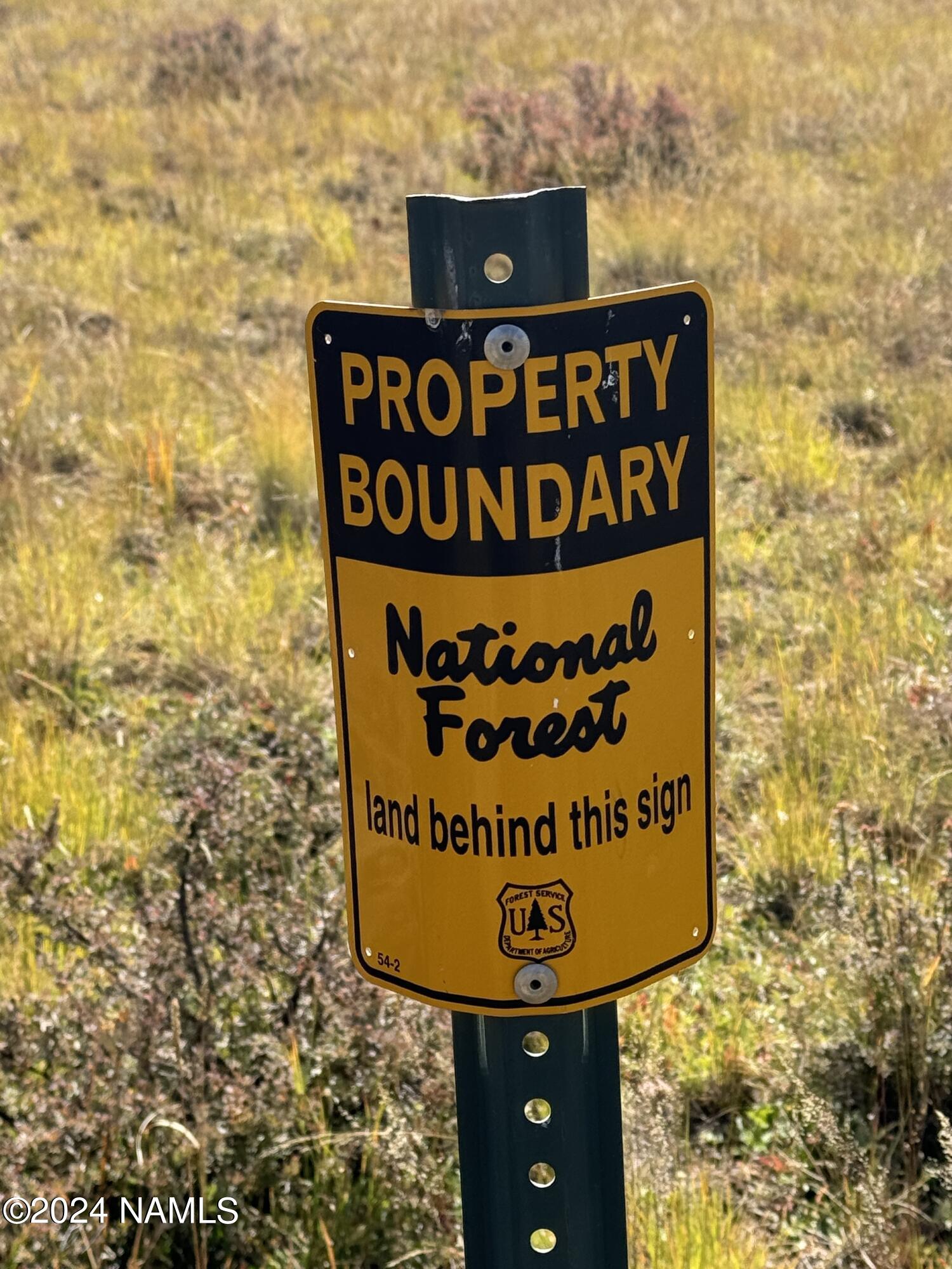 1 Hart Prairie Road Flagstaff, AZ 86001 - Photo 7 of 11 a sign on the wall next to a building