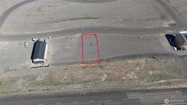 a view of dining room with hardwood floor and a ceiling fan