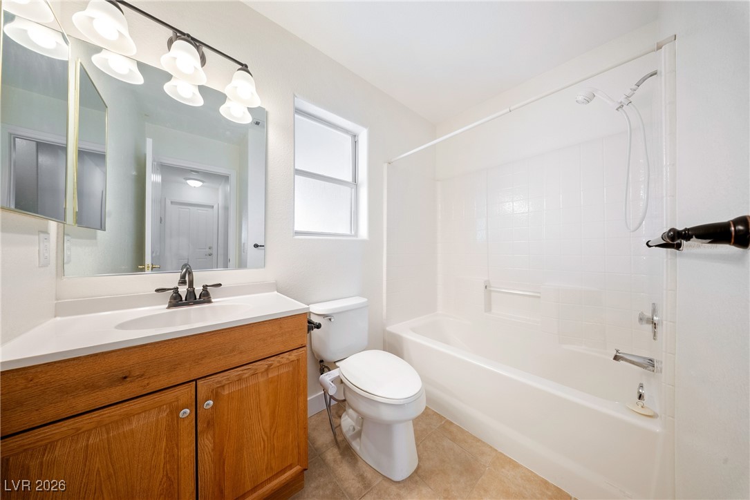 2420 Tough Boy Road Pahrump, NV 89060 - Photo 28 of 54 Bathroom with vanity, tub / shower combination, and tile patterned floors