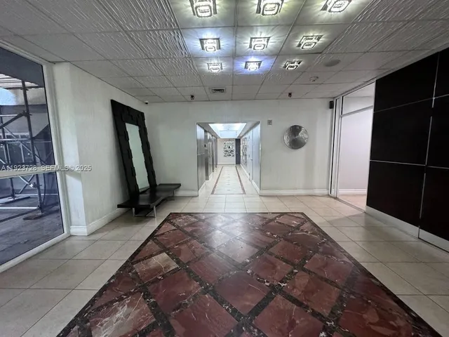 a view of a livingroom with furniture and a chandelier