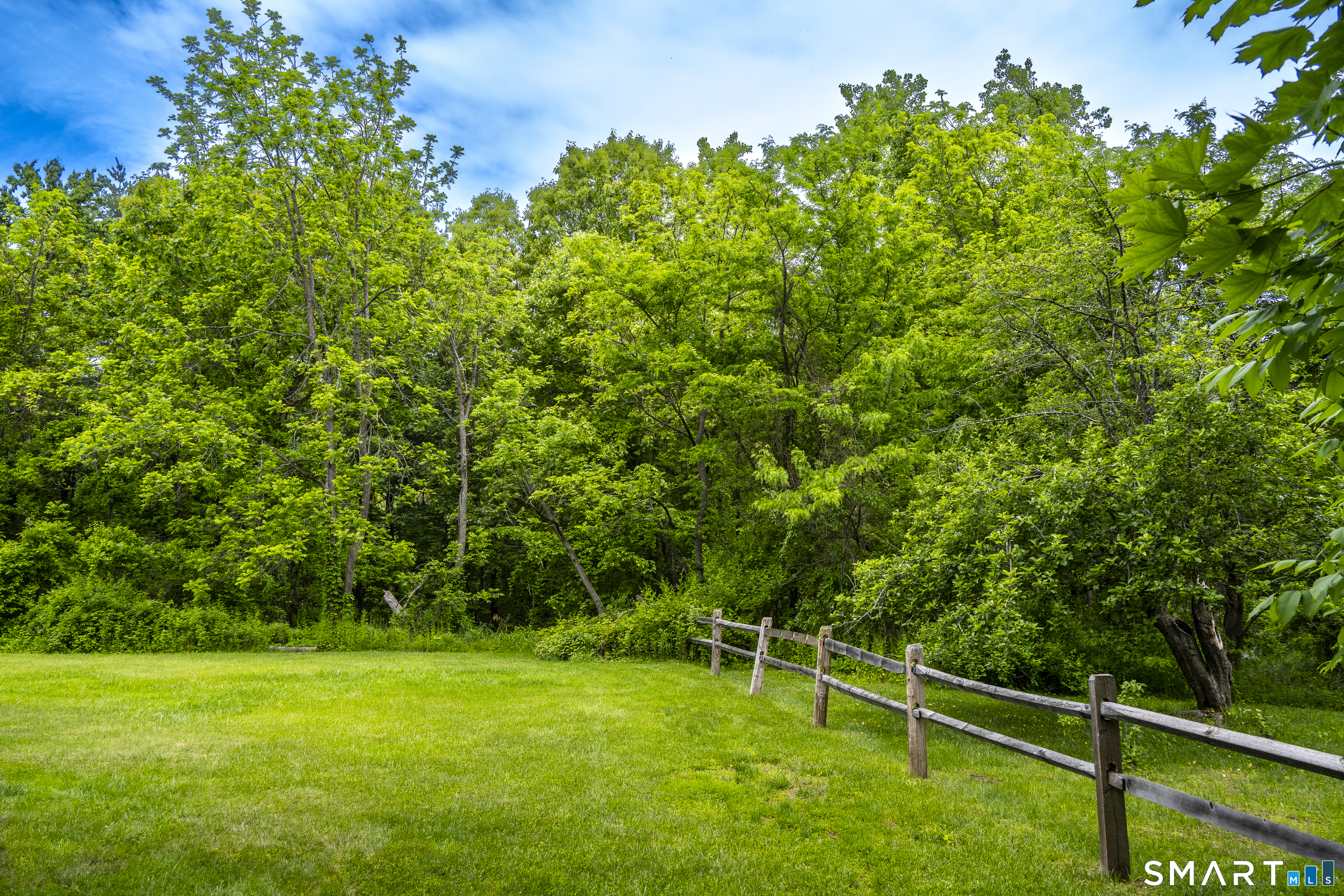 7 Chimney Rock Road Kent, CT 06757 - Photo 33 of 35 a backyard of a house with lots of green space