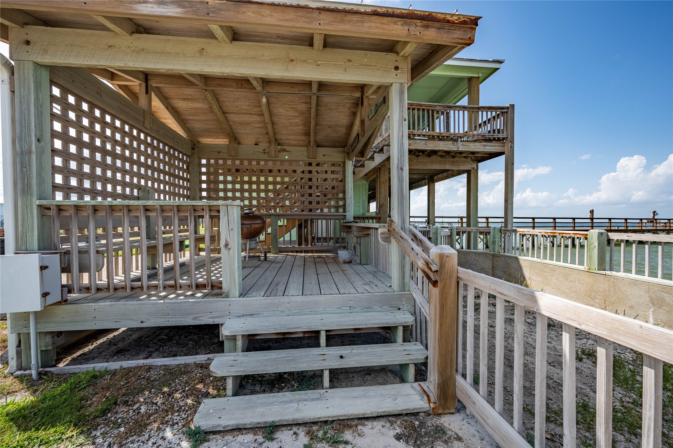 740 Copano Cove Road Rockport, TX 78382 - Photo 9 of 35 a view of staircase with a table and chairs
