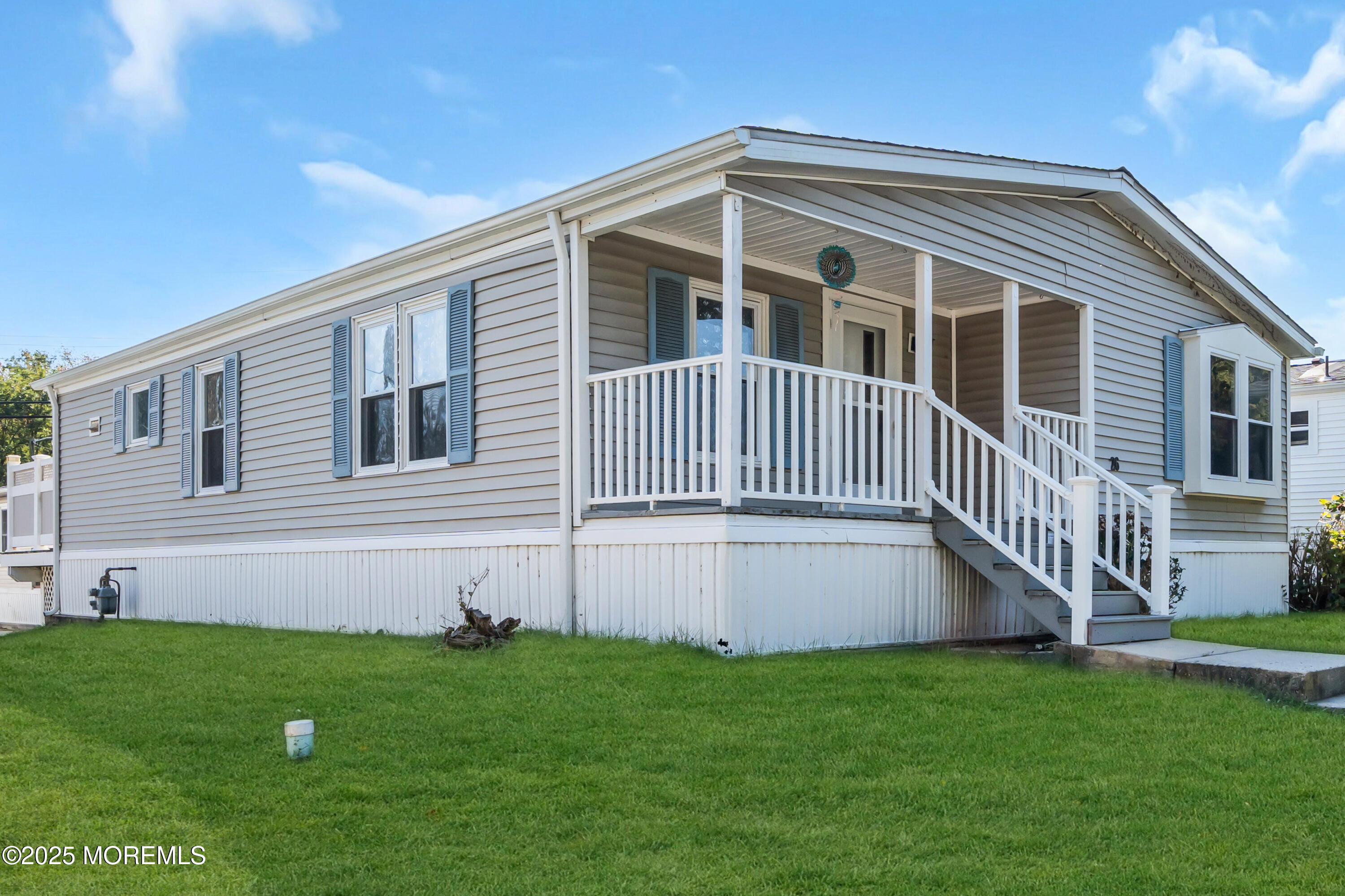 1820 Highway 35, Unit HOME SITE #26 Wall, NJ 07719 - Photo 2 of 35 a front view of a house with a yard