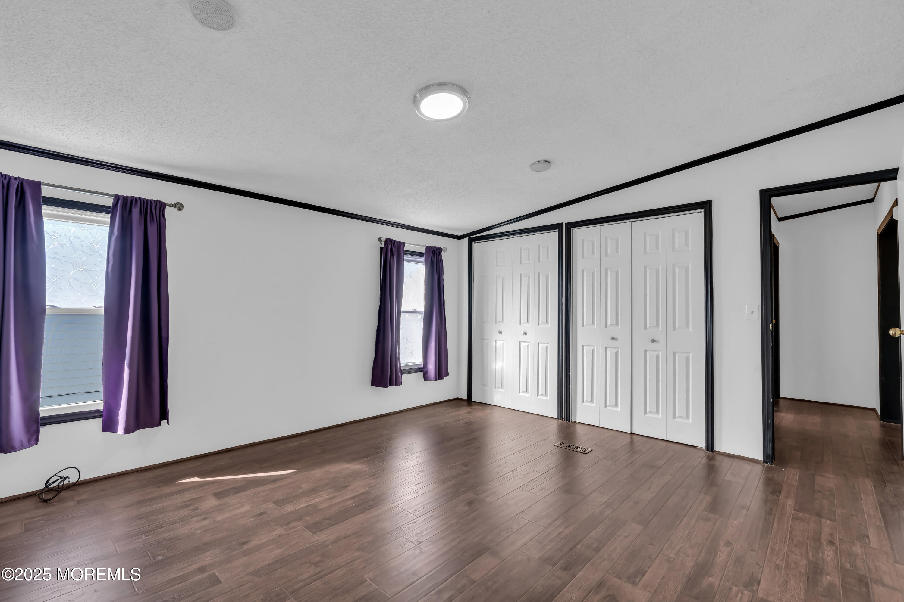 1820 Highway 35, Unit HOME SITE #26 Wall, NJ 07719 - Photo 22 of 35 a view of a livingroom with wooden floor and window
