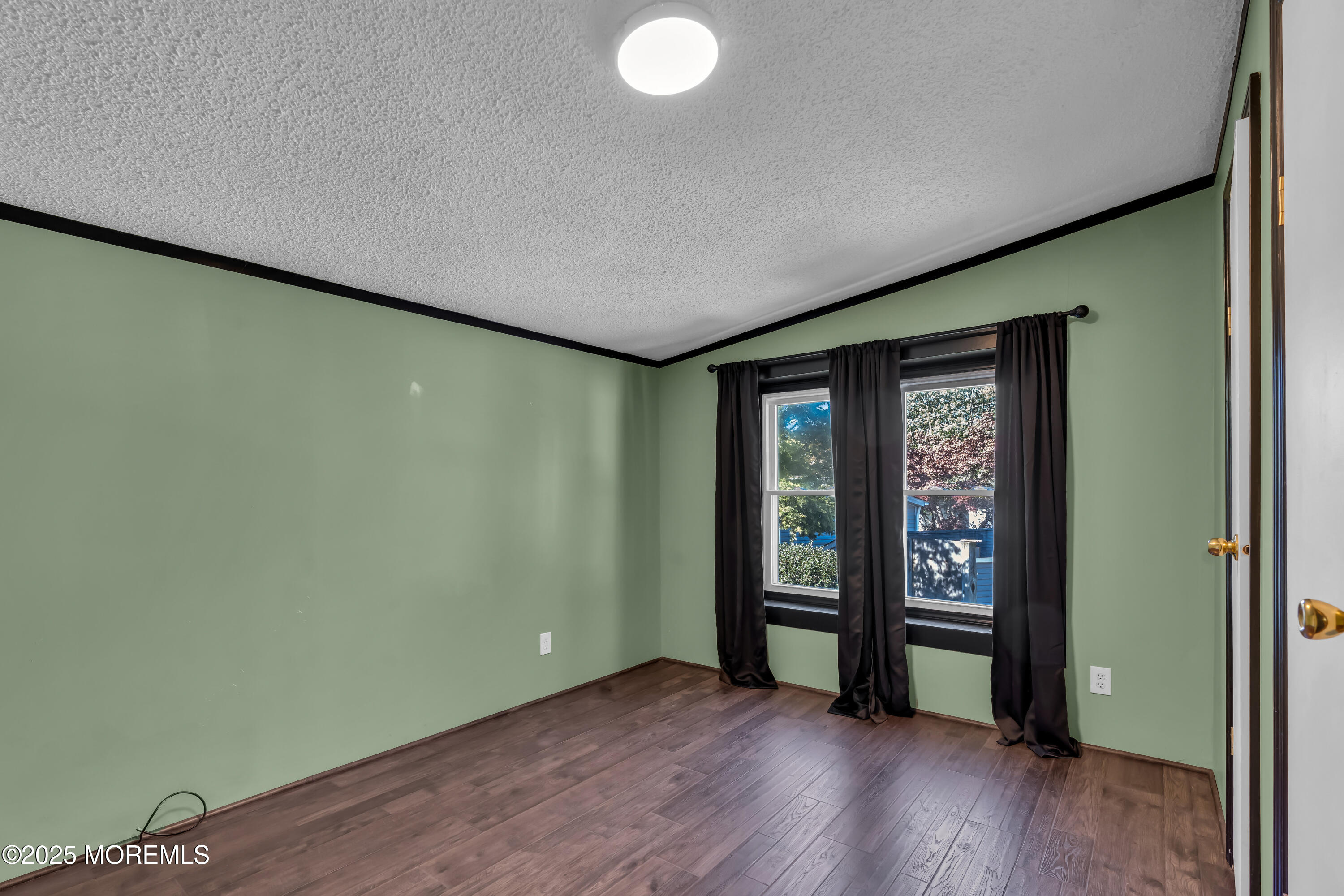 1820 Highway 35, Unit HOME SITE #26 Wall, NJ 07719 - Photo 27 of 35 an empty room with wooden floor and closet
