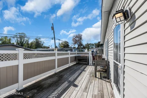a view of a balcony with wooden floor