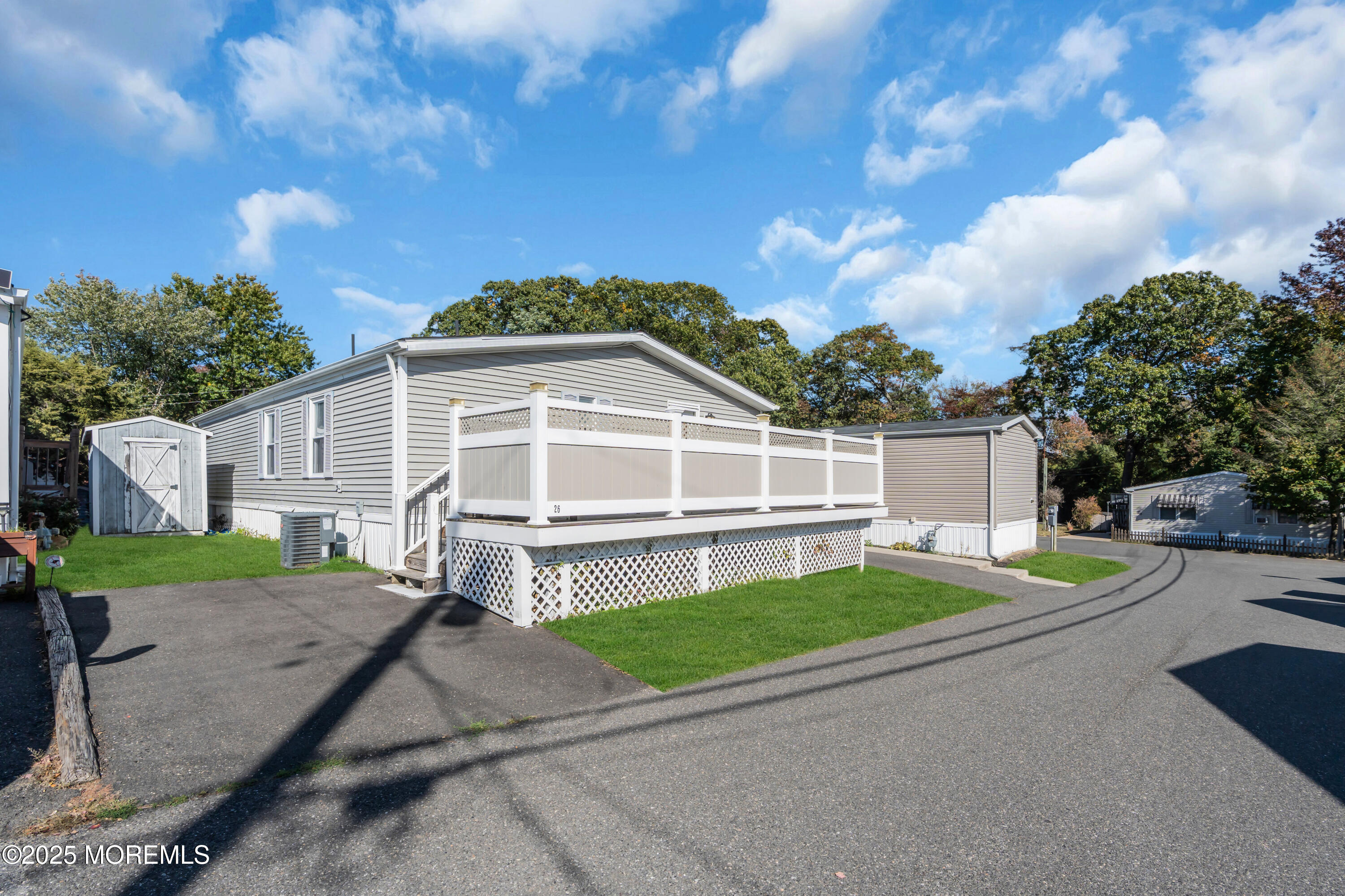 1820 Highway 35, Unit HOME SITE #26 Wall, NJ 07719 - Photo 33 of 35 a view of a house with a yard
