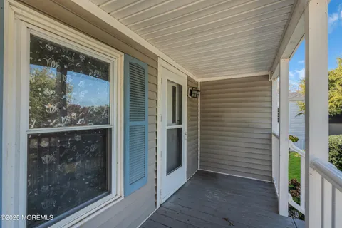 a view of a door and wooden floor
