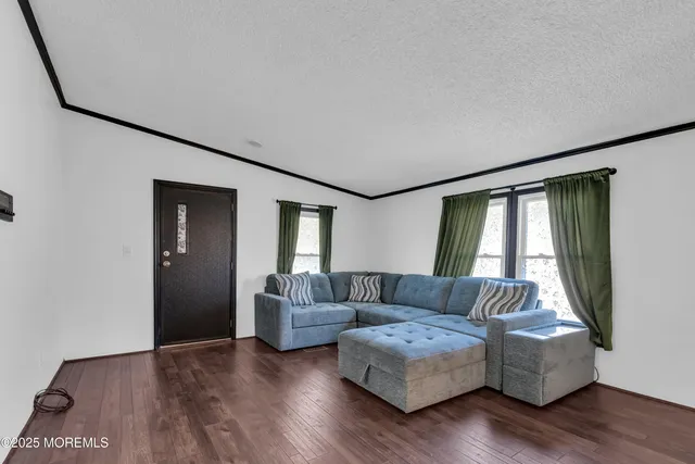 a living room with a couch and a window