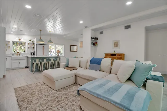 a living room with furniture and a table