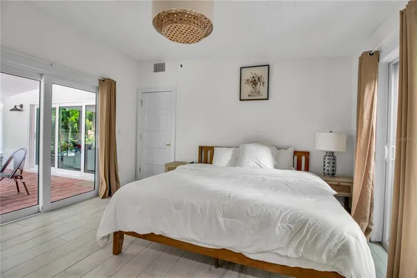 a bedroom with a bed and a table