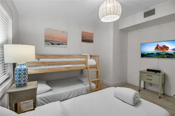 a bedroom with a bed and furniture