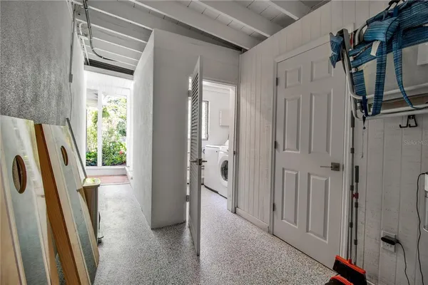 a view of a livingroom with wooden floor and a window