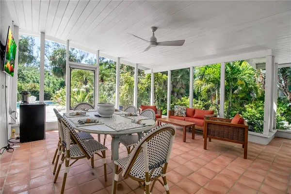 a view of a dining room with furniture window and outside view