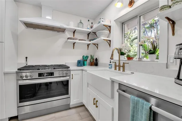a kitchen with a stove and a sink