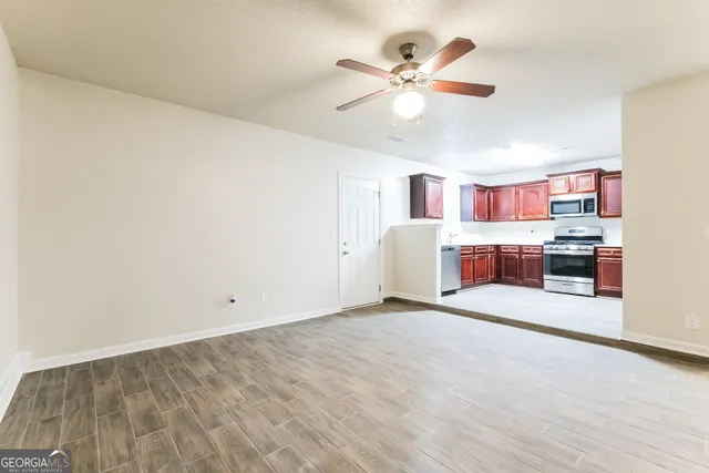 a view of a kitchen with a sink and cabinet