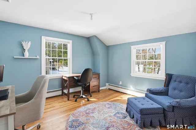 a workspace with furniture and a window