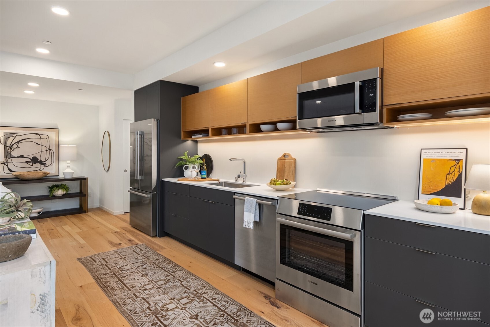 200 Shepard Way Northwest Bainbridge Island, WA 98110 - Photo 11 of 29 a kitchen with stainless steel appliances granite countertop a stove microwave and sink