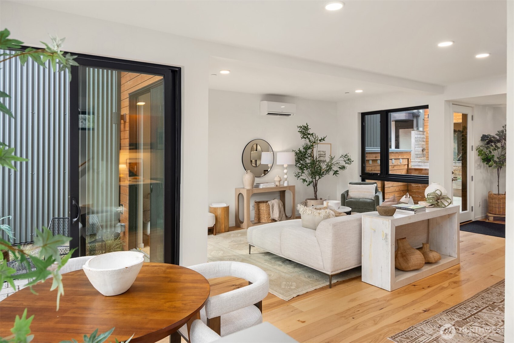 200 Shepard Way Northwest Bainbridge Island, WA 98110 - Photo 2 of 29 a living room with fireplace furniture and a table