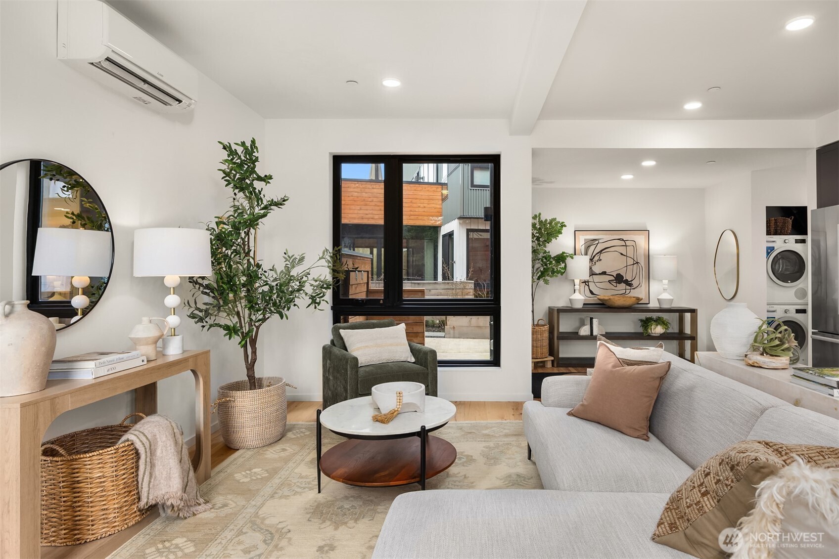 200 Shepard Way Northwest Bainbridge Island, WA 98110 - Photo 3 of 29 a living room with furniture and a potted plant