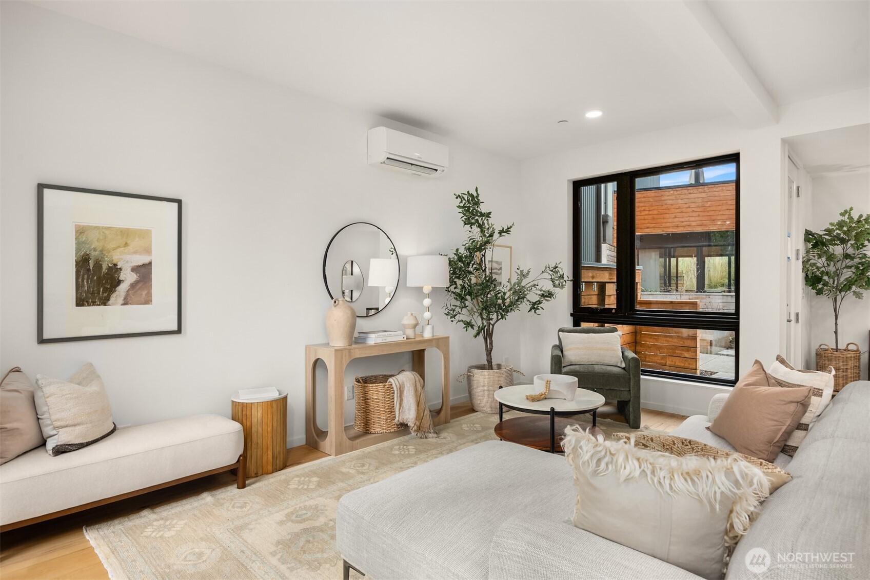 200 Shepard Way Northwest Bainbridge Island, WA 98110 - Photo 4 of 29 a living room with furniture a lamp and a large window