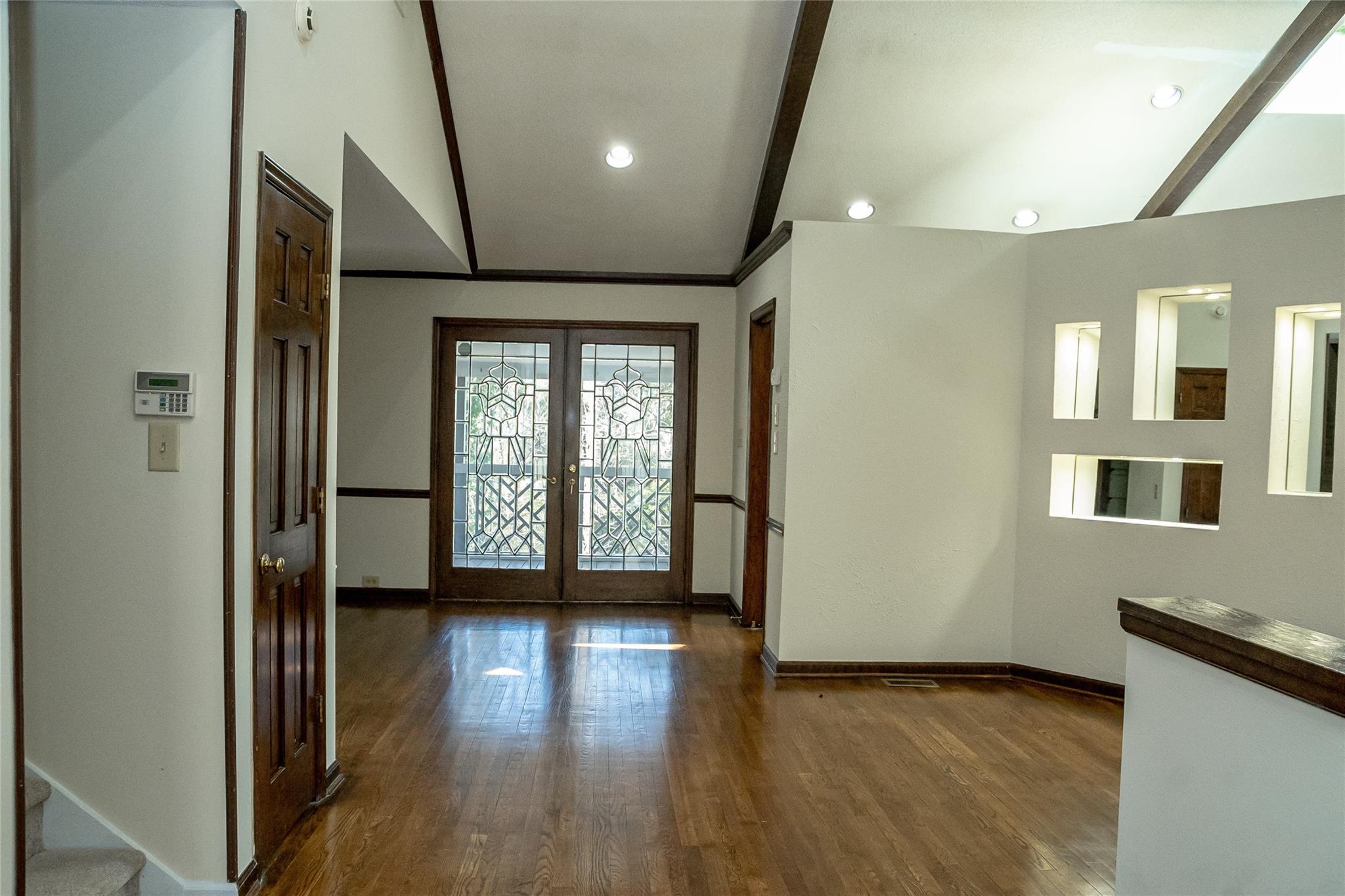212 Riverside Drive Morganton, NC 28655 - Photo 13 of 44 a view of an empty room with glass door and wooden floor