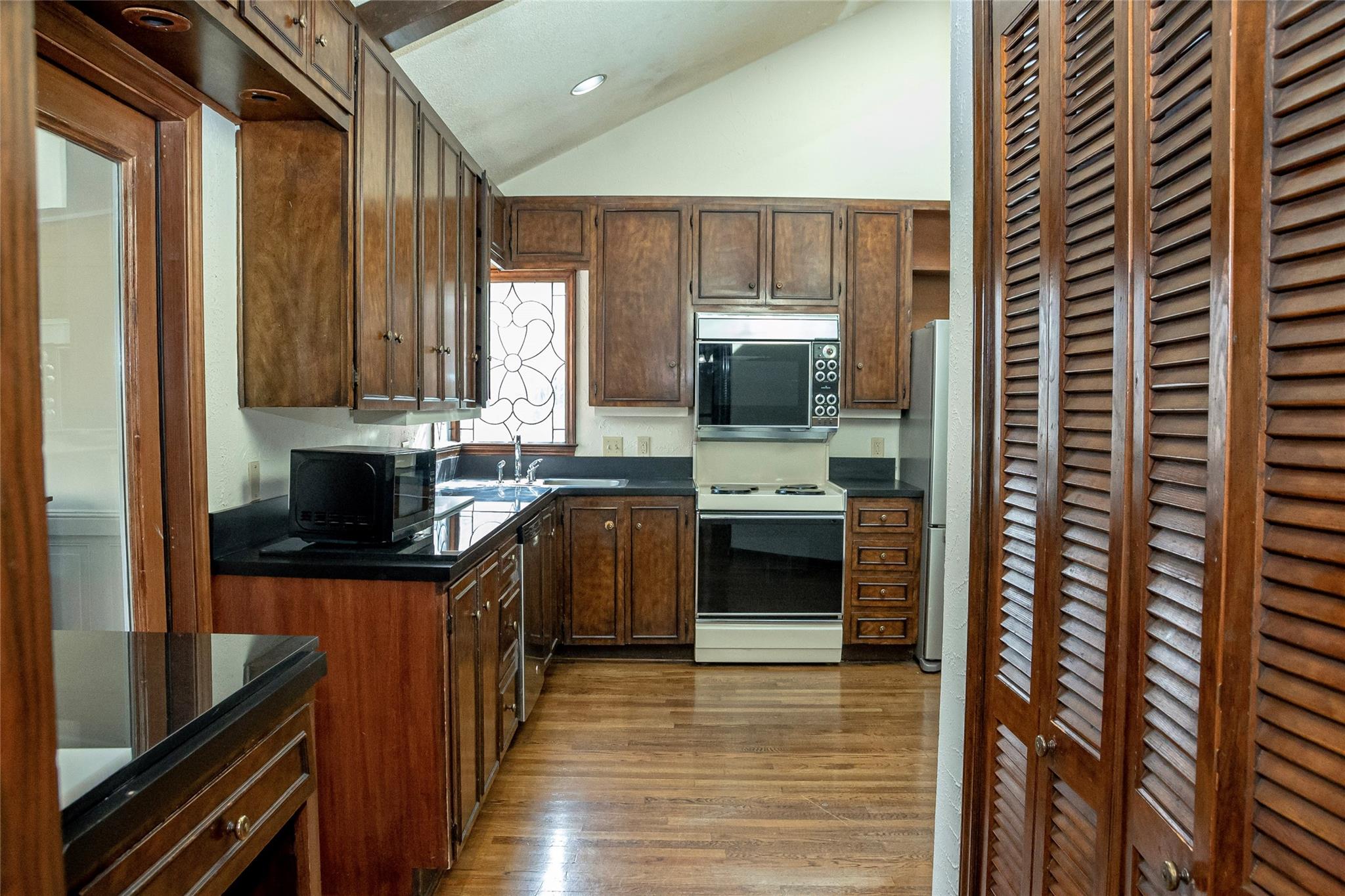 212 Riverside Drive Morganton, NC 28655 - Photo 14 of 44 a kitchen with stainless steel appliances a stove top oven a sink and a refrigerator
