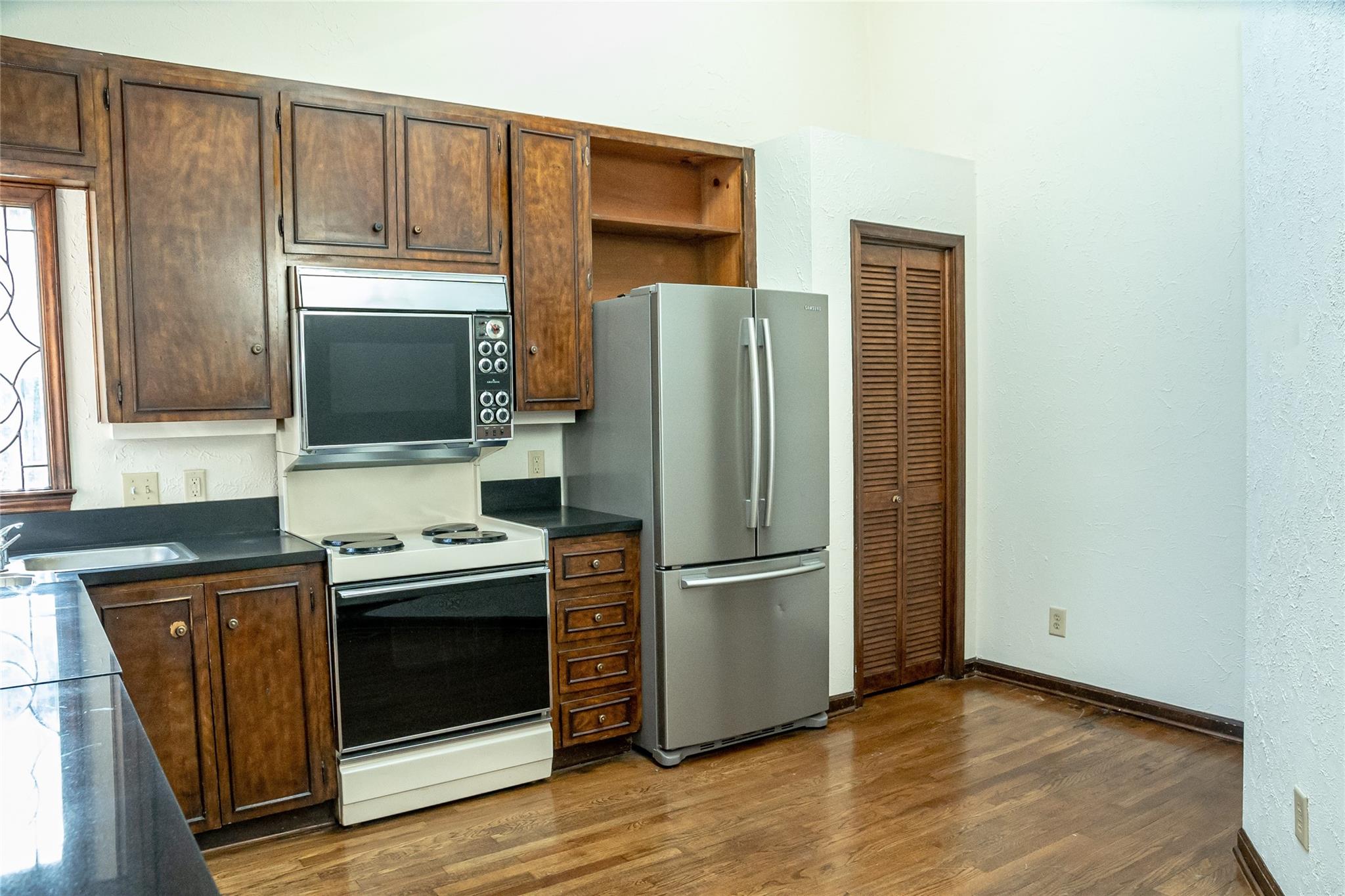 212 Riverside Drive Morganton, NC 28655 - Photo 15 of 44 a kitchen with stainless steel appliances granite countertop a refrigerator stove and sink