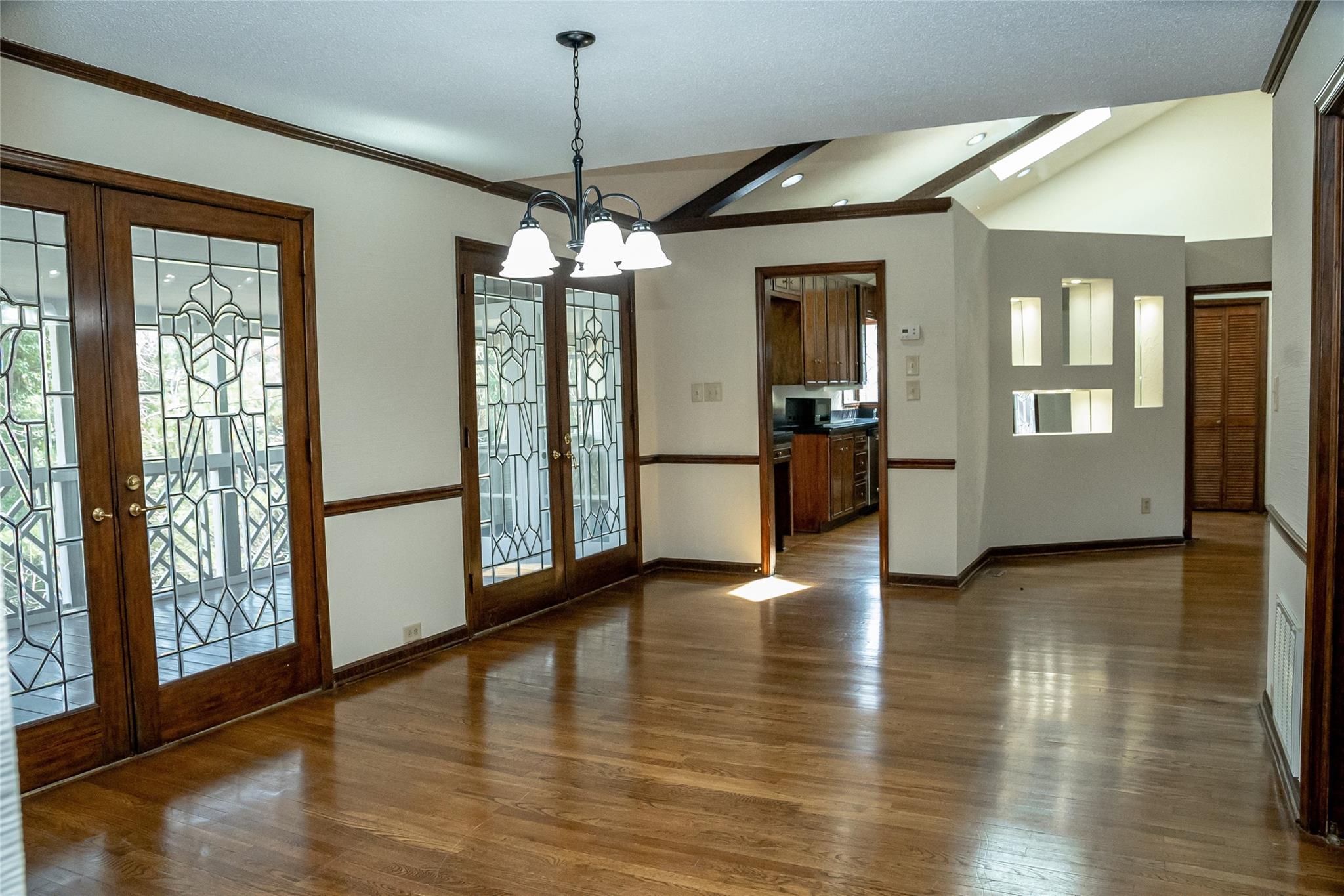 212 Riverside Drive Morganton, NC 28655 - Photo 18 of 44 a view of a big room with wooden floor windows and chandelier