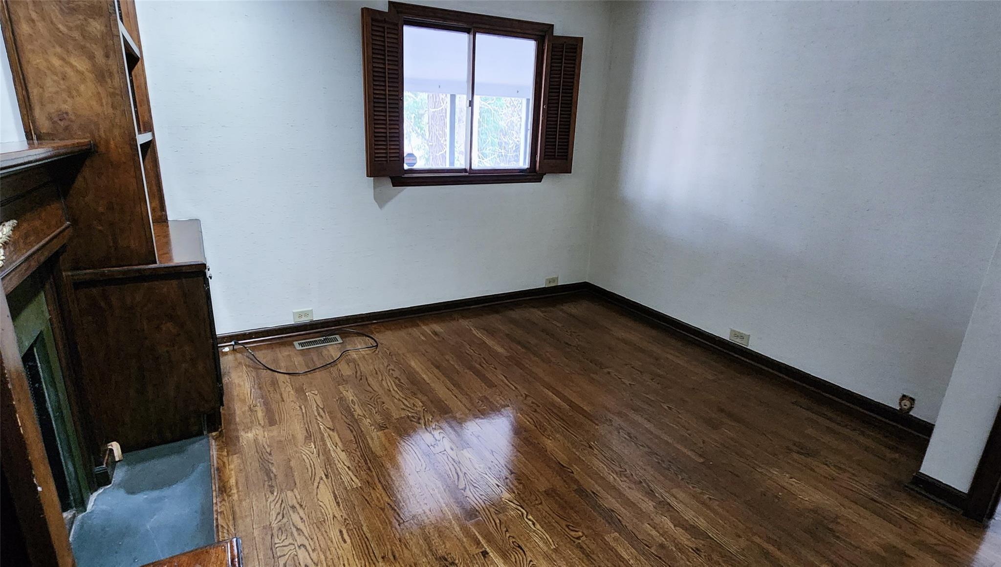 212 Riverside Drive Morganton, NC 28655 - Photo 23 of 44 a view of an empty room with wooden floor and a window