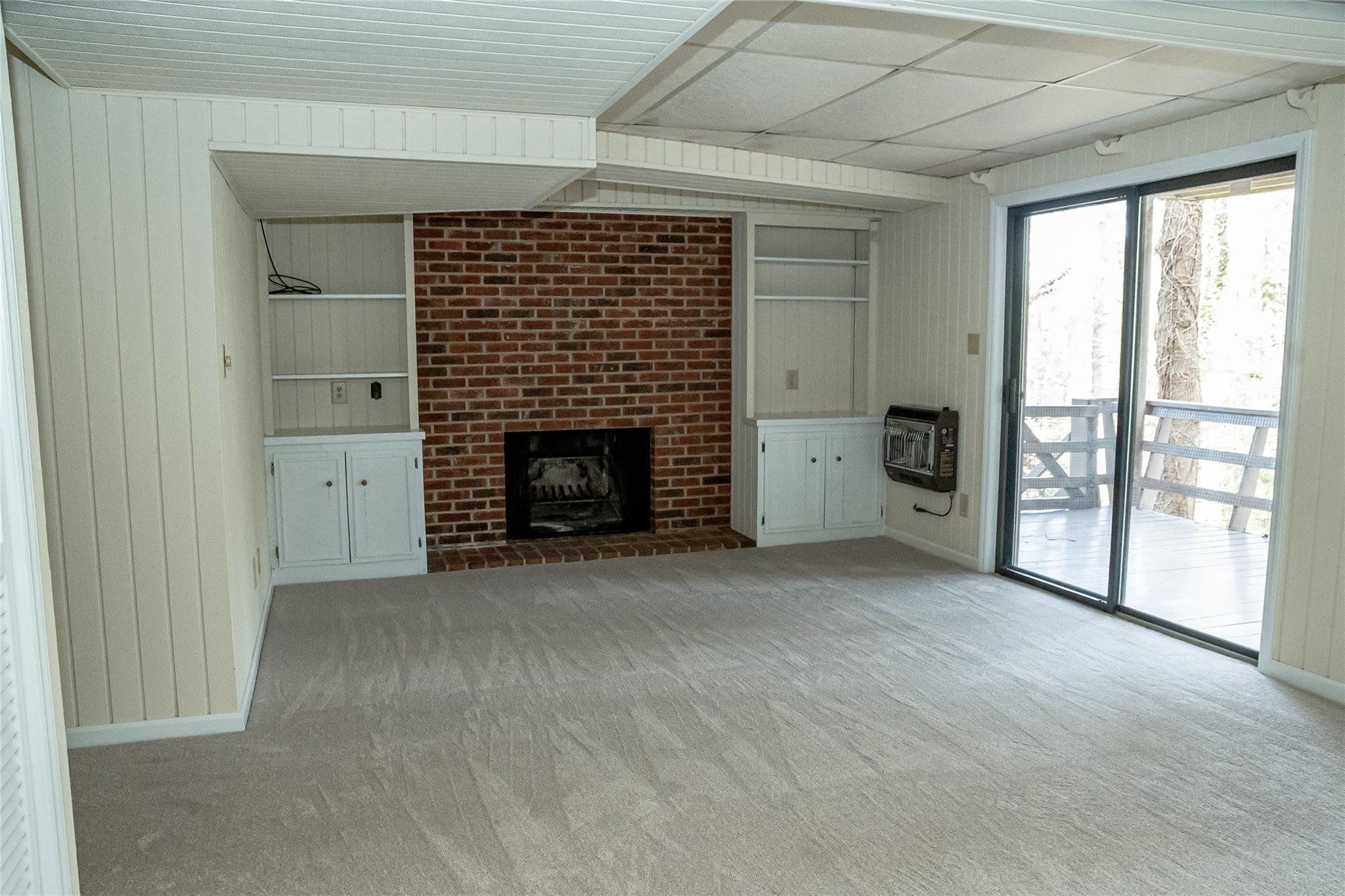 212 Riverside Drive Morganton, NC 28655 - Photo 35 of 44 an empty room with fireplace and windows