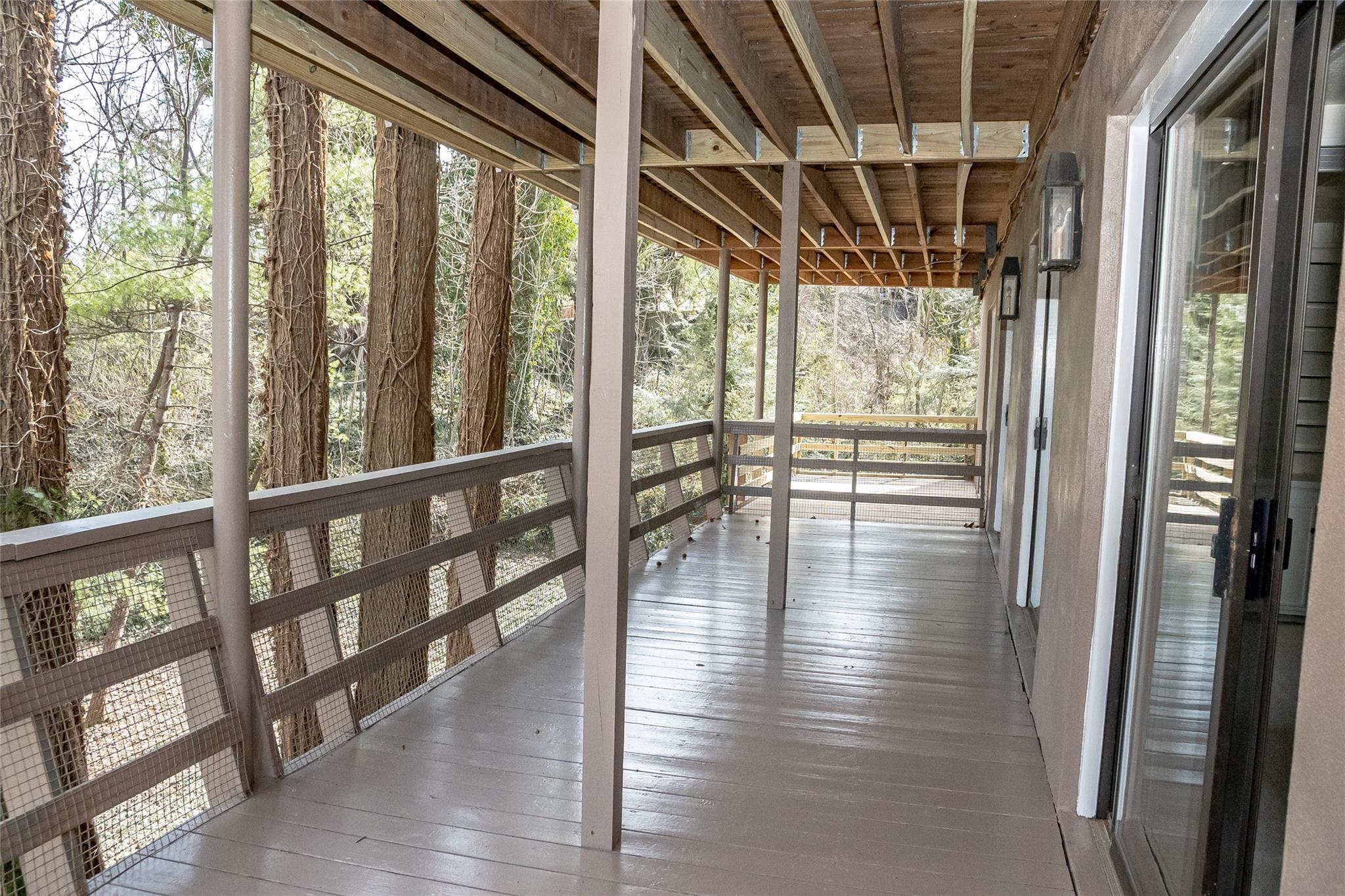 212 Riverside Drive Morganton, NC 28655 - Photo 37 of 44 a view of a porch with wooden floor and furniture
