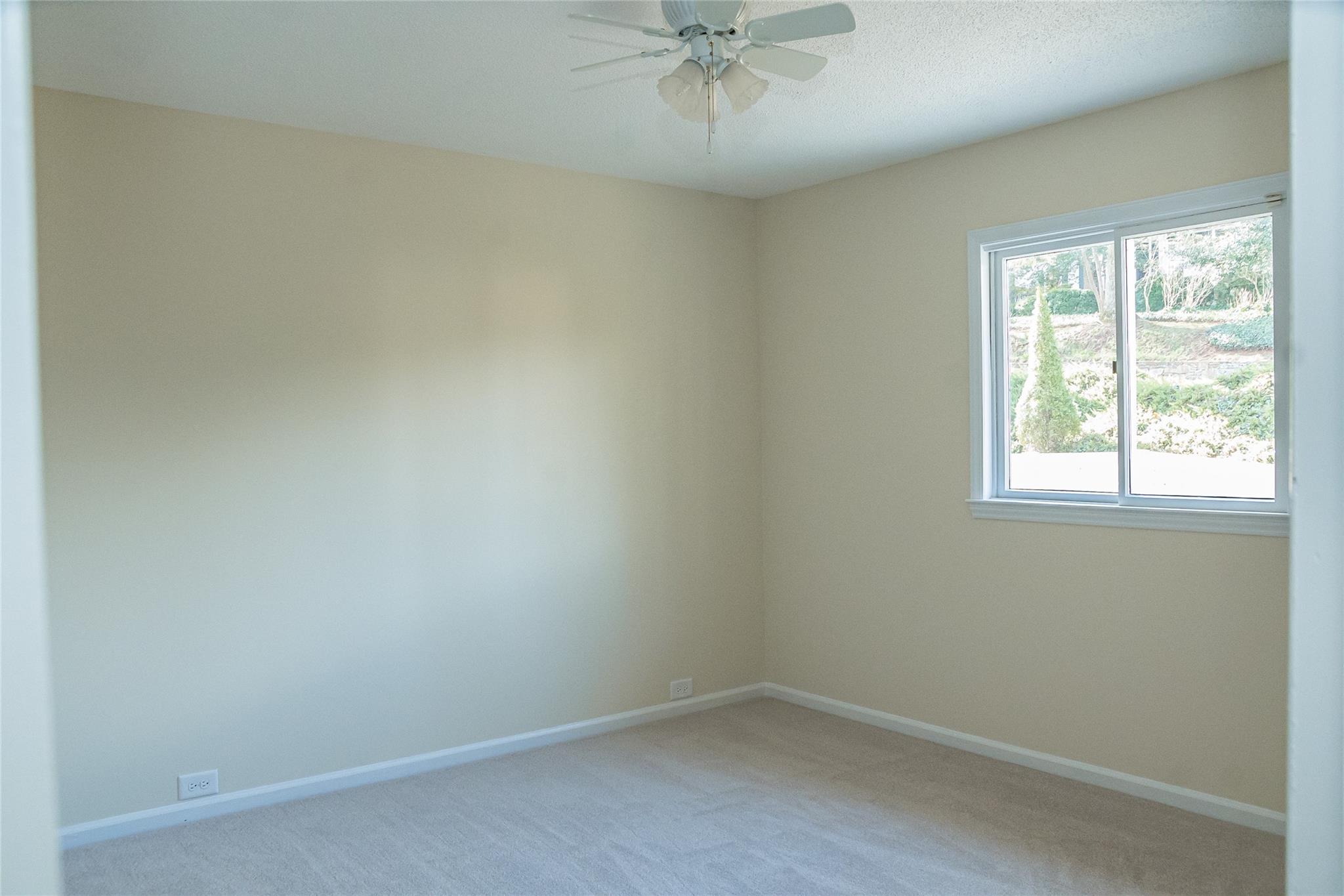 212 Riverside Drive Morganton, NC 28655 - Photo 40 of 44 an empty room with a window and a fan