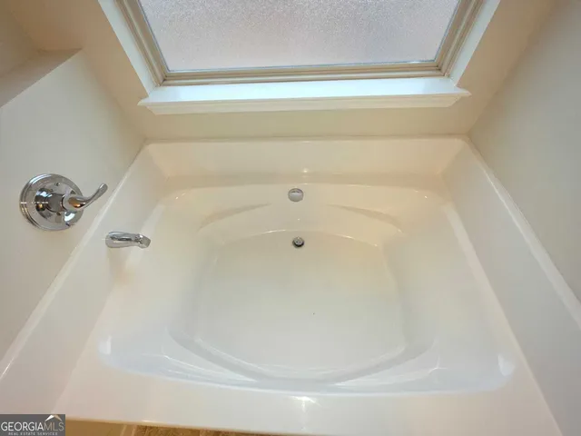 a close up of a bathtub in a bathroom