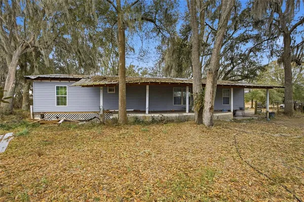a house with trees in the background
