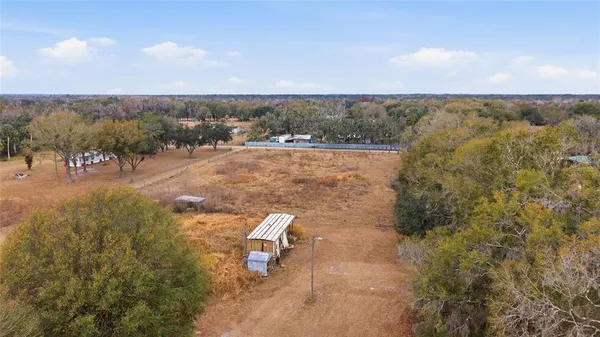an aerial view of residential house and outdoor space