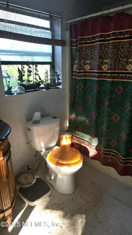 a room with furniture and a flat screen tv