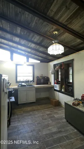 a kitchen with a stove and a refrigerator