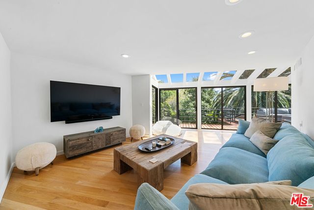 a view of a patio with couches and a fire pit
