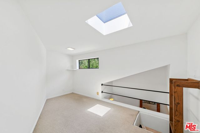 a bathroom with a sink a shower and a mirror