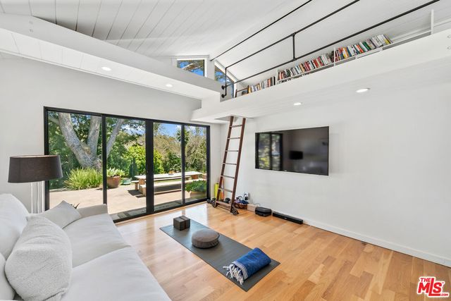 a kitchen with stainless steel appliances kitchen island granite countertop a stove and a refrigerator