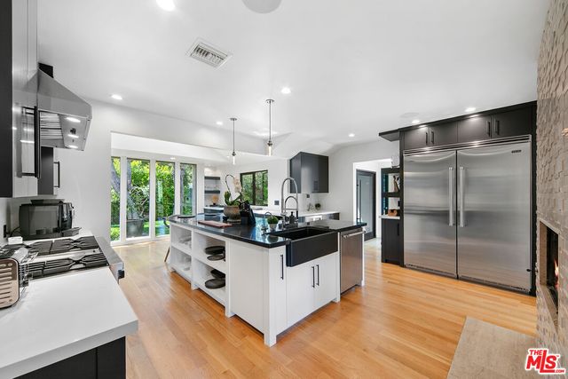 a bedroom with furniture and a wooden floor