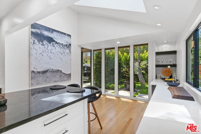 a bed room with a bed and a television